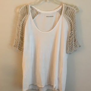 White t-shirt with torn, mesh short sleeves.
